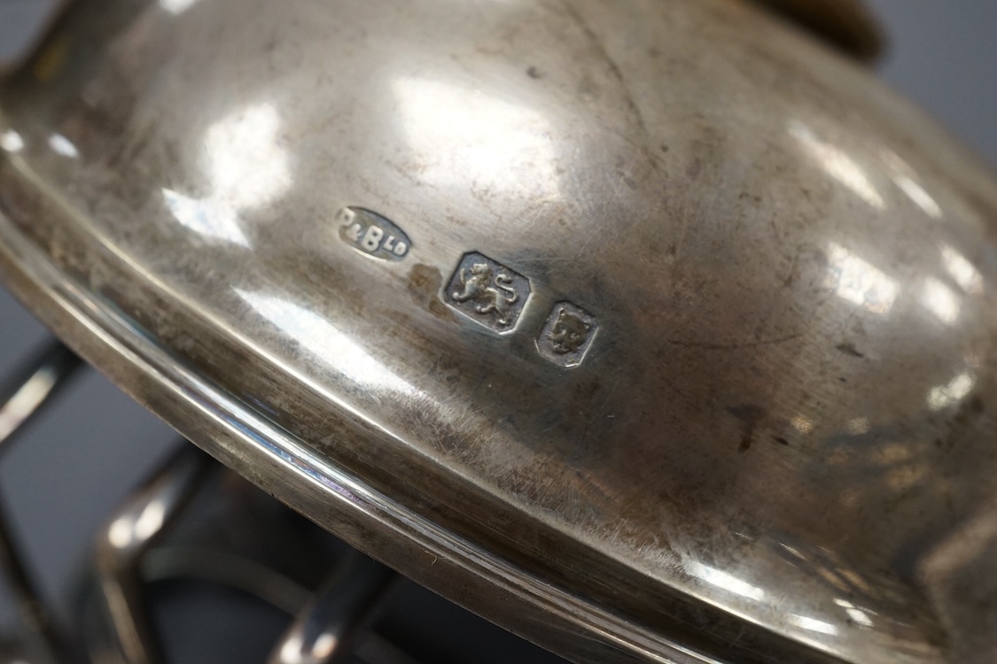 A pair of George V silver five bar toast racks, by Atkin Brothers, Sheffield, 1912, length 94mm, together with a silver muffin dish lid and a silver pedestal bonbon dish, 26.2ox